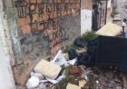 São Sebastião do Passé- Esquina que tem o aviso de  "Proibido Jogar lixo" , acumula lixo e sofá.